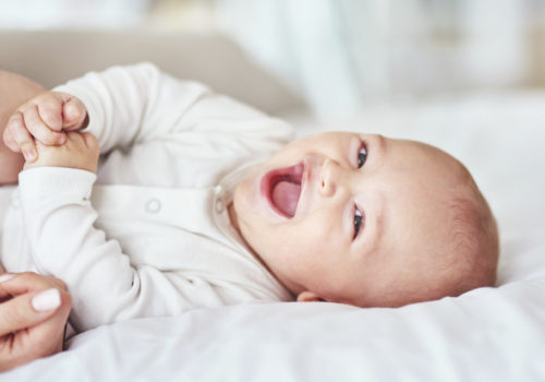 Shot of an adorable baby boy bonding with his mother at home